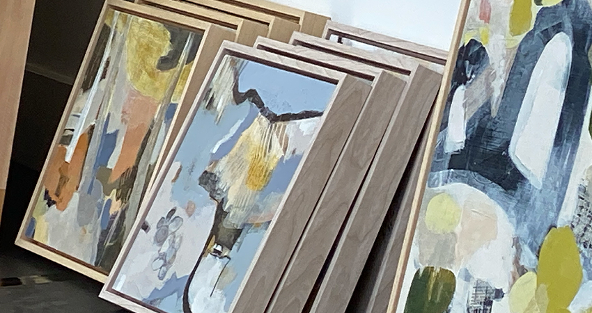 Frame pictures leaning against a wall